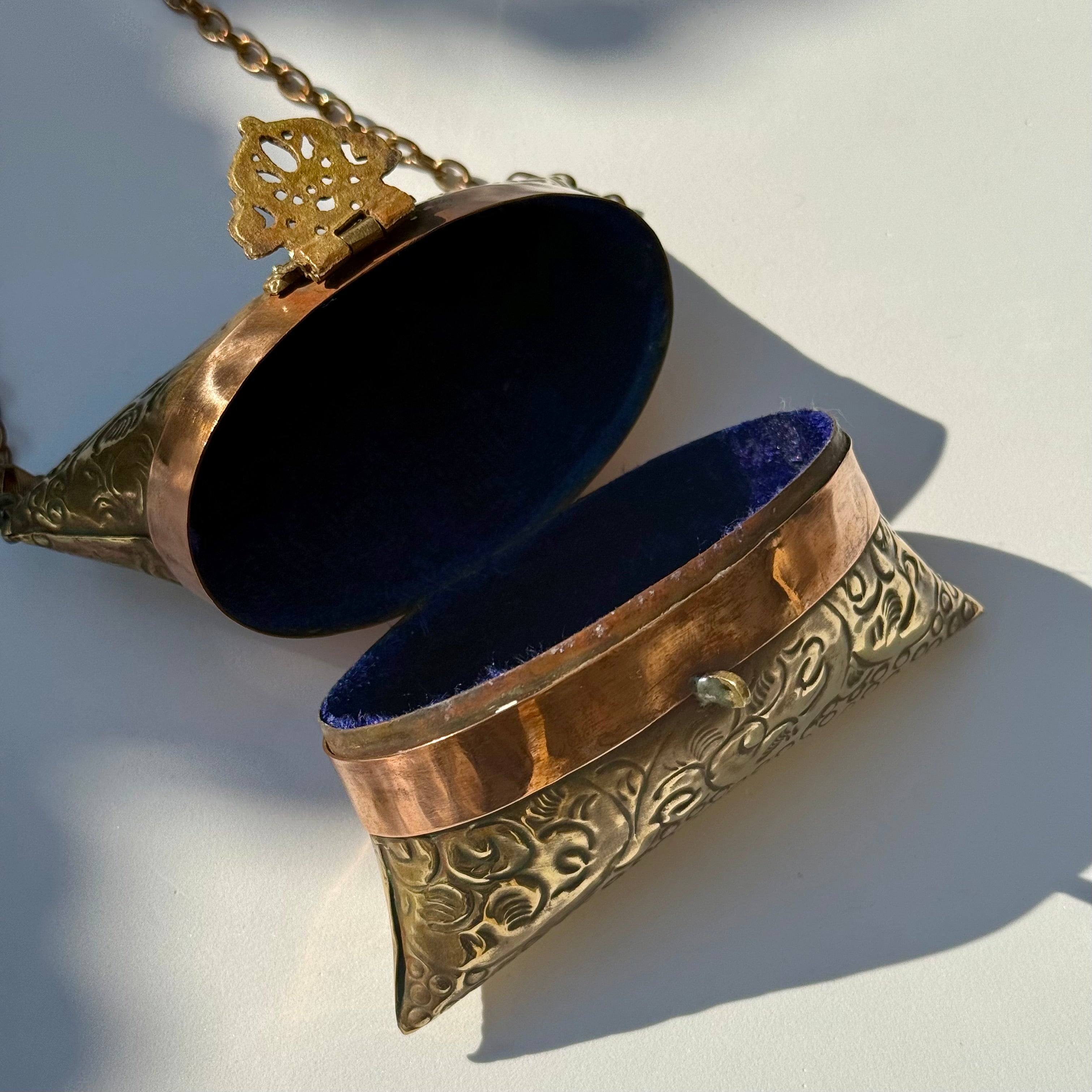 Antique-Style Embossed Brass Pillow Clutch