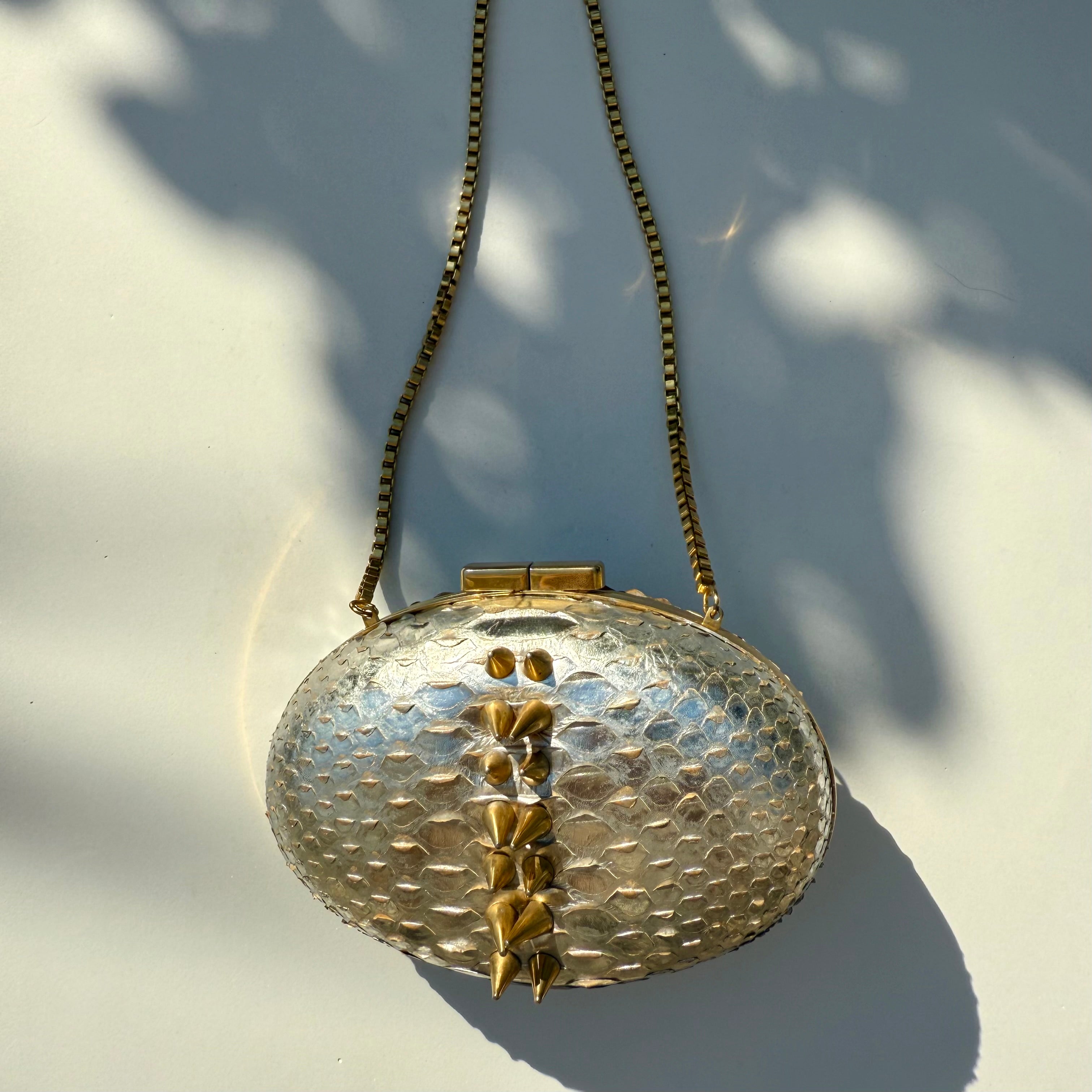 Rami Kadi Silver Python Leather Oval Clutch with Gold Studs