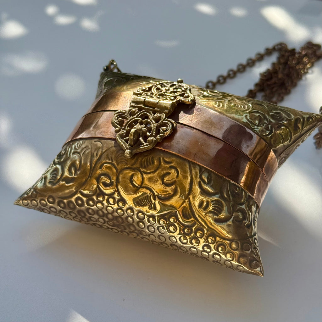 Antique-Style Embossed Brass Pillow Clutch