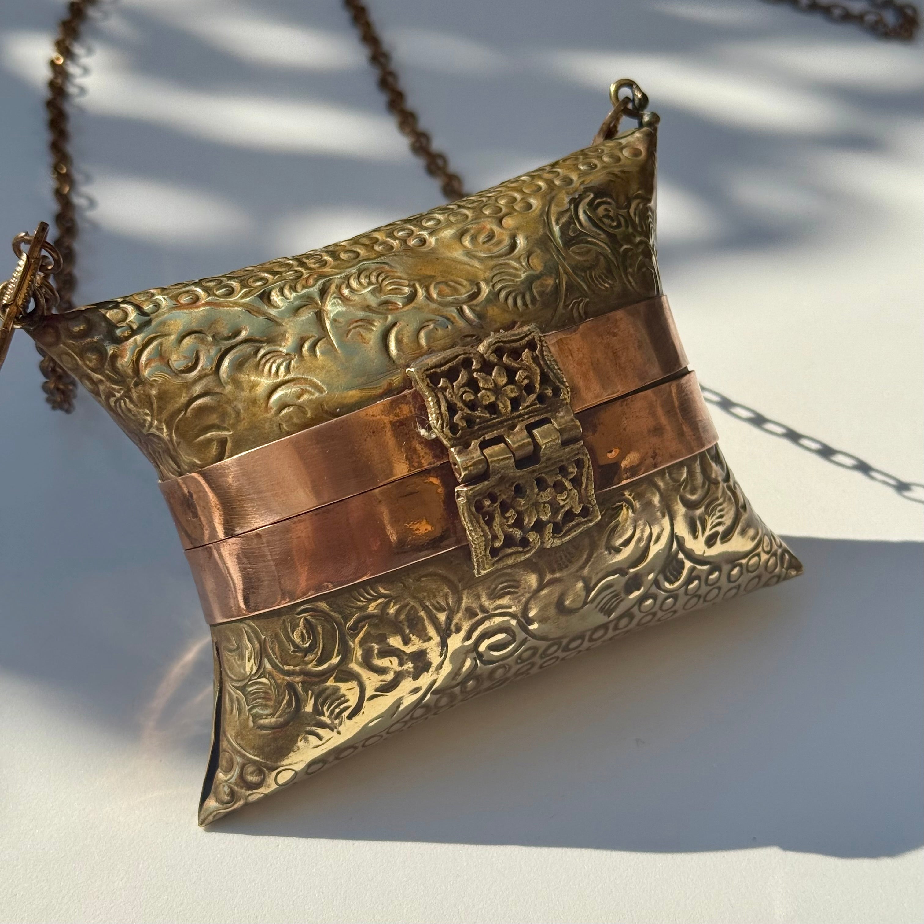 Antique-Style Embossed Brass Pillow Clutch